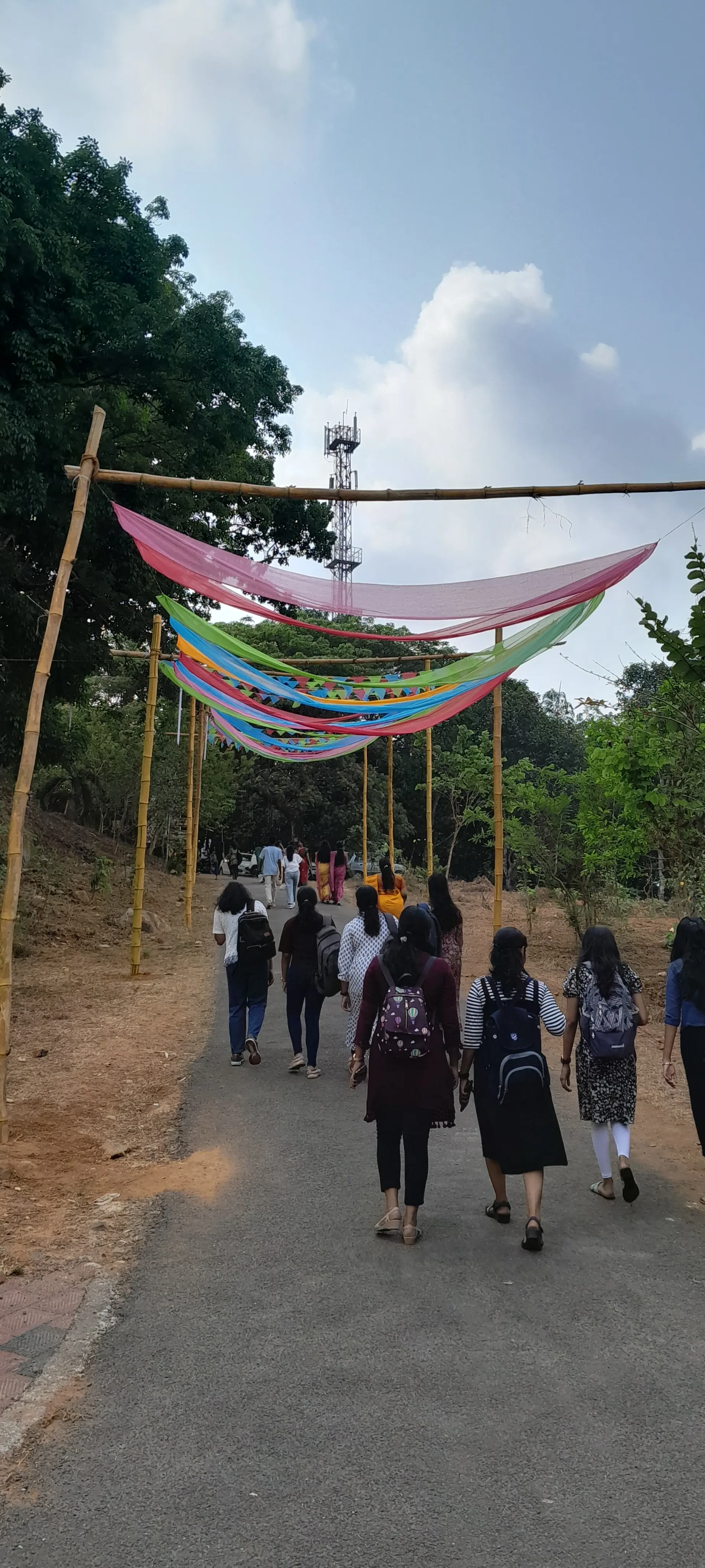 A road leading uphill decorated with pennant bunting.